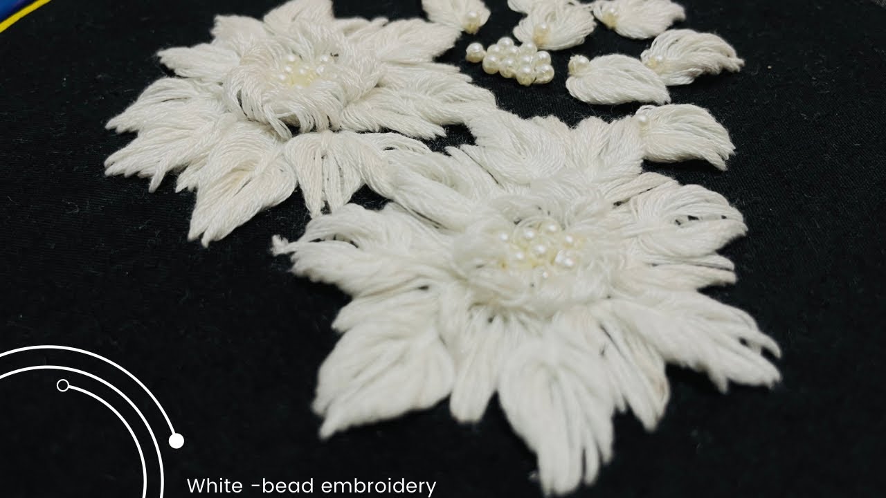 white embroidery on black fabric